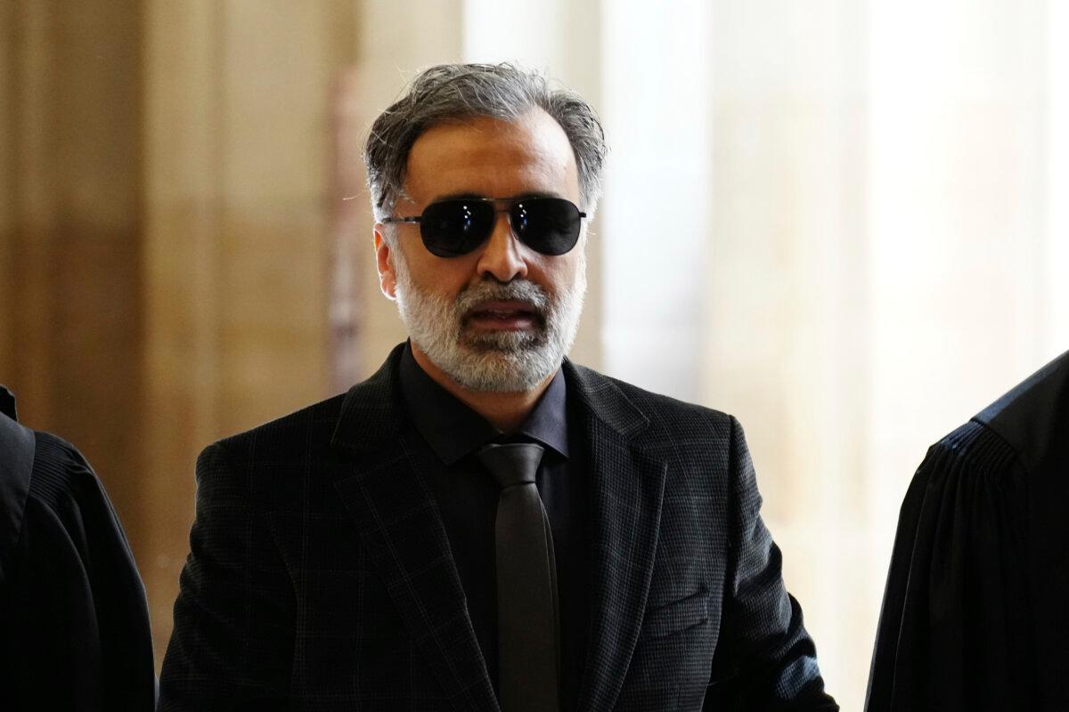 Abderrahmane Ouatiki, who was working as a hotel receptionist and was allegedly held at gunpoint by the robbers during the 2016 armed robbery of Kim Kardashian, arrives at the palace of justice in Paris on April 28, 2025. (Aurelien Morissard/AP Photo)