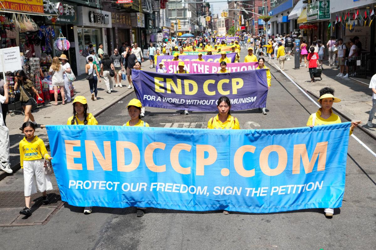 Falun Gong practitioners march during a parade calling for the end of the Chinese Communist Party’s 26 years of ongoing persecution against the spiritual practice, in New York City on July 20, 2025. (Larry Dye/The Epoch Times)