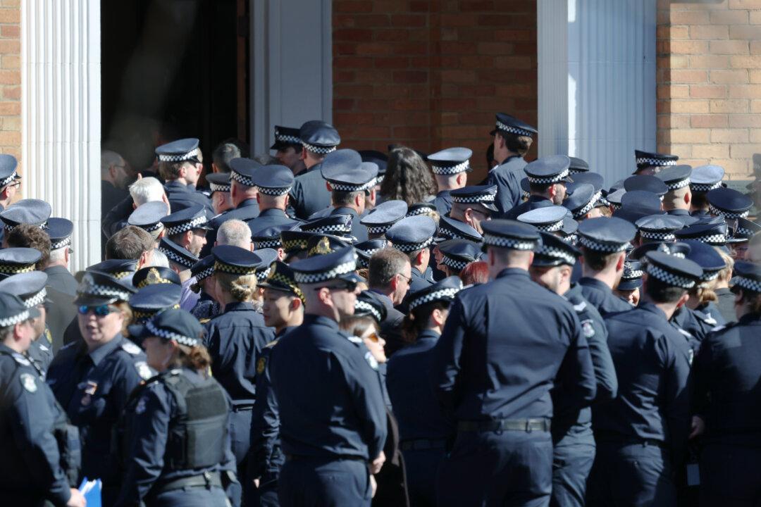 Sea of Blue as Fallen Police Officer Farewelled, Manhunt for Alleged Killer Intensifies