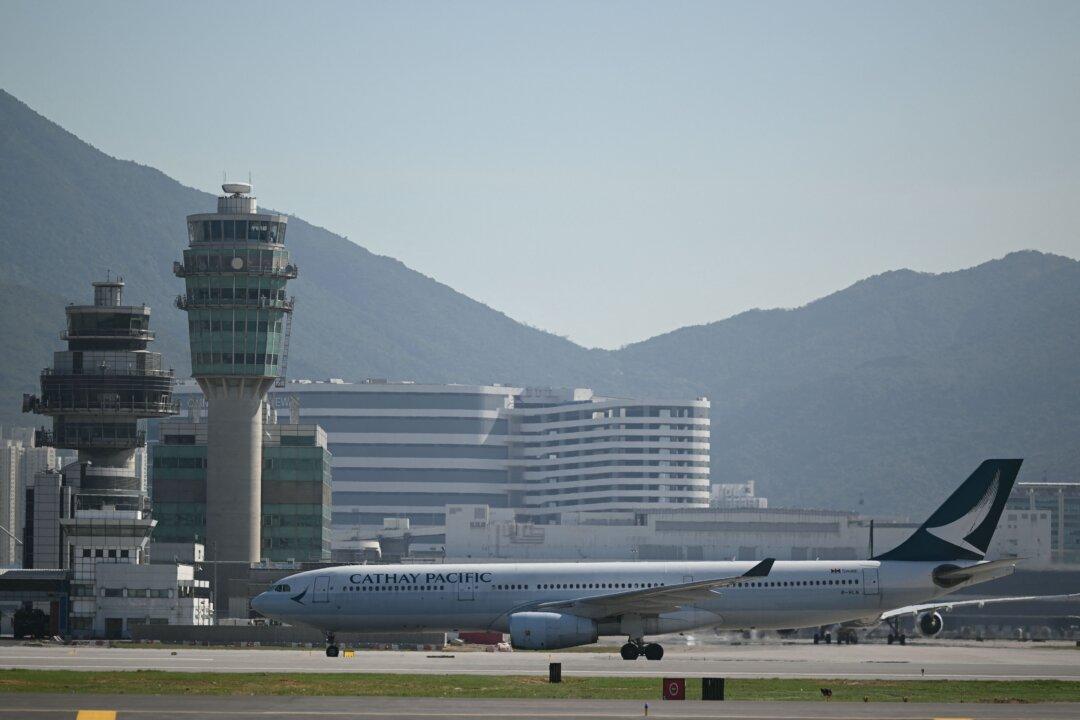 Cargo Aircraft Skids Off Hong Kong Runway Into Sea, Killing 2 People
