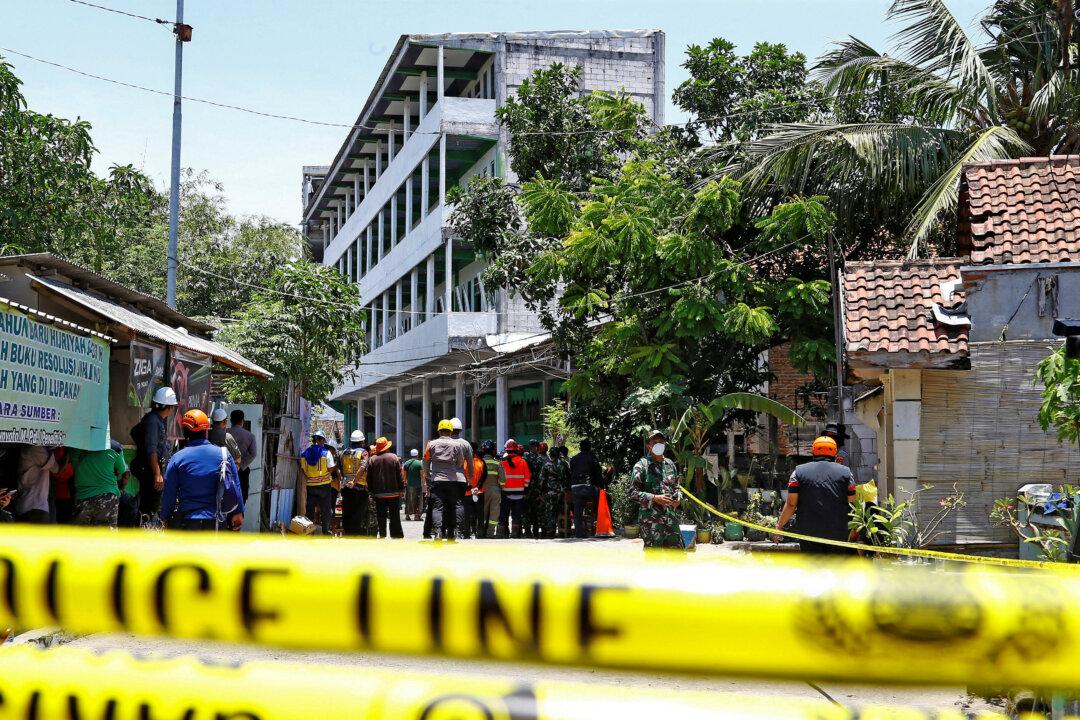 Indonesia Ends Search for Victims of Boarding School Collapse, 61 Dead