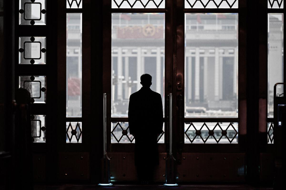 A security guard stands at his post during the opening session of the National People's Congress (NPC) at the Great Hall of the People in Beijing on March 5, 2024. (WANG ZHAO/AFP via Getty Images)