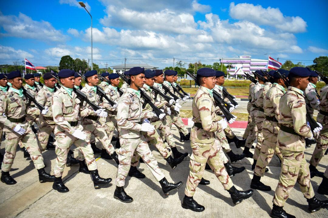 Thai civilian defence volunteers take part in a parade on the eve of the annual Defence Volunteers Day in Narathiwat, southern Thailand on February 9, 2026. (Photo by Madaree TOHLALA / AFP via Getty Images)
