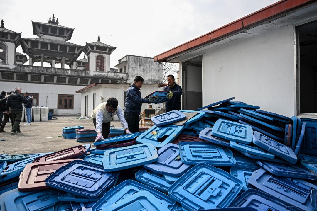 Election officials inspect ballot boxes before they are dispatched from the Election Commission office in Kathmandu on February 9, 2026 ahead of Nepal's general elections. (Photo by Prakash MATHEMA / AFP via Getty Images)