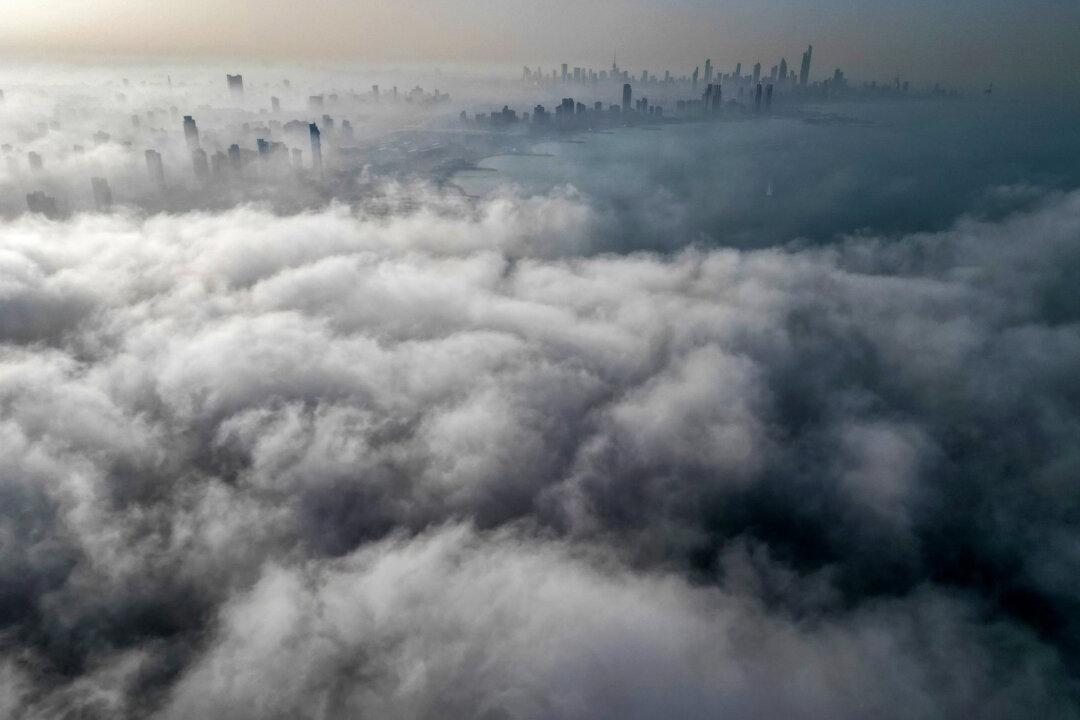 TOPSHOT - Buildings are seen through a veil of fog rolling over al-Salmeyya district in Kuwait City on February 9, 2026. (Photo by Yasser Al-Zayyat / AFP via Getty Images)