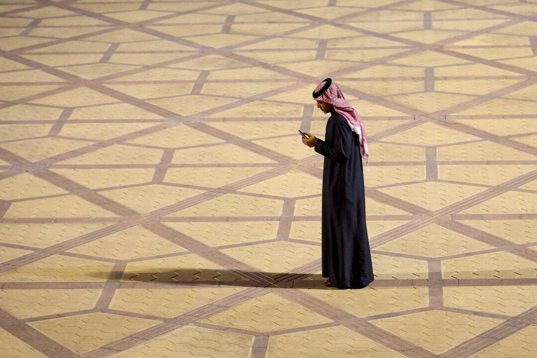 RIYADH, SAUDI ARABIA - FEBRUARY 9: A man wearing a thawb waits for the arrival of Britain's Prince William at King Khalid International Airport on day one of his first official visit to Saudi Arabia on February 9, 2026 in Riyadh, Saudi Arabia. (Photo by Isabel Infantes - Pool/Getty Images)
