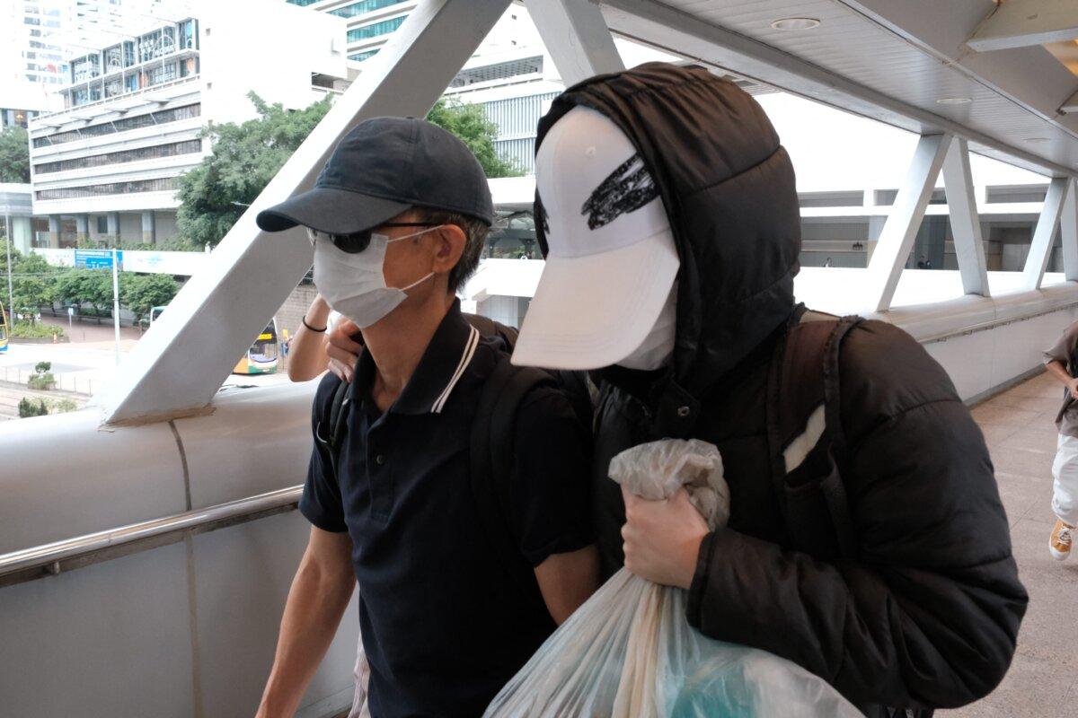 Kwok Yin-sang (L) leaves the High Court after a judge granted him bail in Hong Kong on May 20, 2025. (Tommy Wang/AFP via Getty Images)