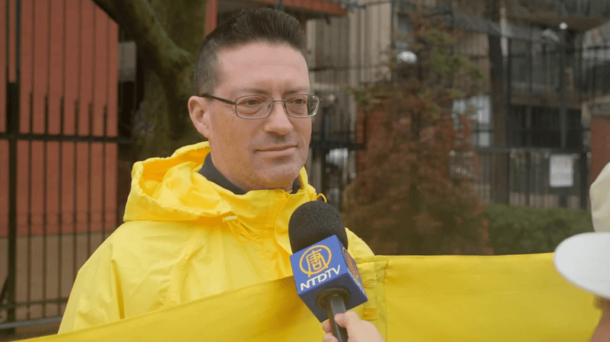 Toronto Falun Gong practitioner Daniel Sky speaks to reporters outside the Chinese Consulate in Toronto on April 25, 2026, during an event to commemorate the 27th anniversary of Falun Gong practitioners’ April 25, 1999, appeal in Beijing calling for freedom of belief. (Eric R/NTD)