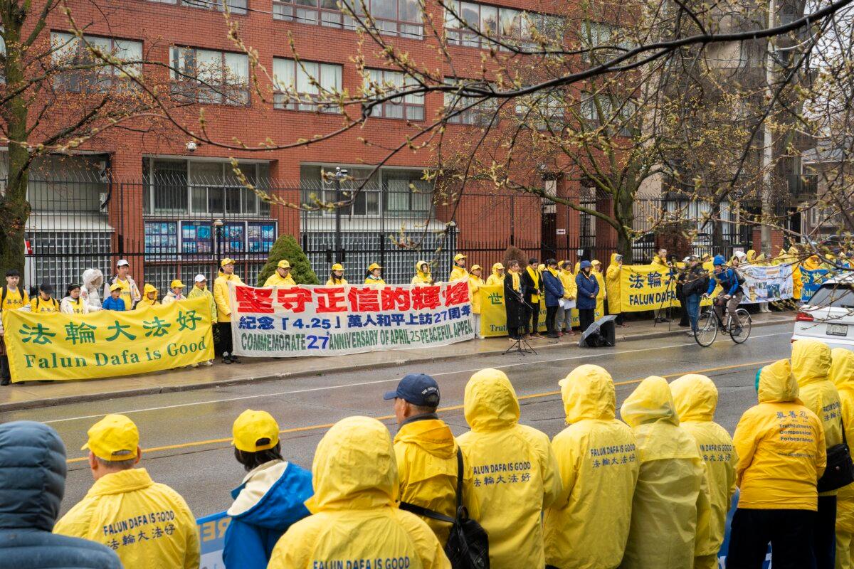 Falun Gong practitioners gather in front of the Chinese Consulate in Toronto on April 25, 2026, to commemorate the 27th anniversary of their fellow practitioners’ April 25, 1999, appeal in Beijing calling for freedom of belief. (Evan Ning/The Epoch Times)