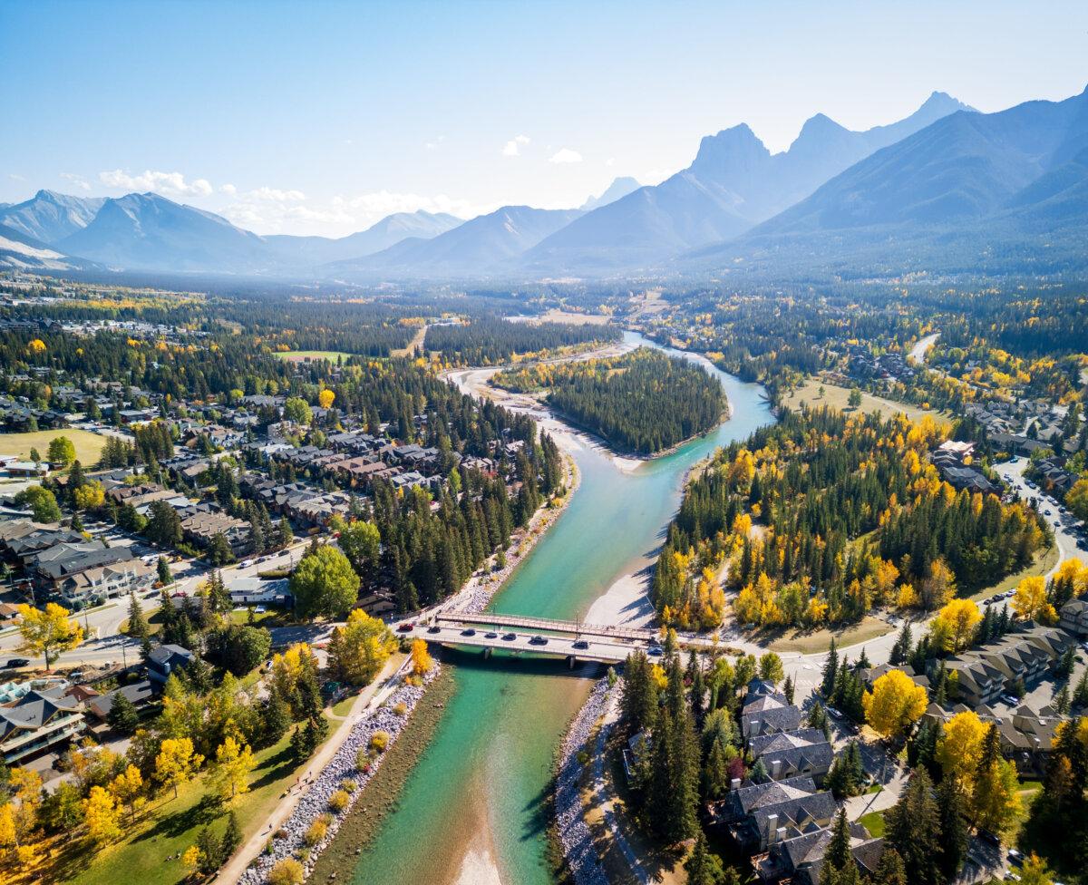 Aerial view of Canmore and the Bow River in Alberta, with the Rockies in the background. (Shutterstock/Shawn.ccf)