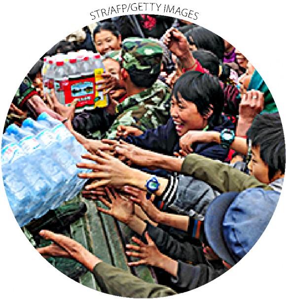 Chinese villagers collect bottled water in Qinglong, China's Yunnan Province, on<br/>April 4, 2010.