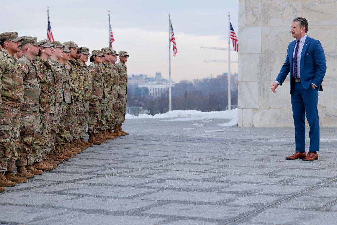 WASHINGTON, DC - FEBRUARY 06: U.S. Secretary of War Pete Hegseth address a group of National Guard troops before conducting their re-enlistment ceremony at the base of the Washington Monument on February 06, 2026 in Washington, DC. Braving sub-freezing temperatures, Hegseth led a re-enlistment ceremony for 105 National Guard troops from Alabama, Arkansas, Florida, Indiana, Mississippi, Ohio, Oklahoma, South Carolina and West Virginia on the National Mall. (Photo by Chip Somodevilla/Getty Images)