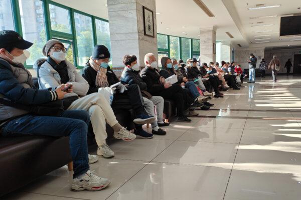 People wait for funeral services for their deceased relatives at Baoxing Funeral Parlor in Shanghai on Jan. 4, 2023. (Wang Gang /VCG via Getty Images)
