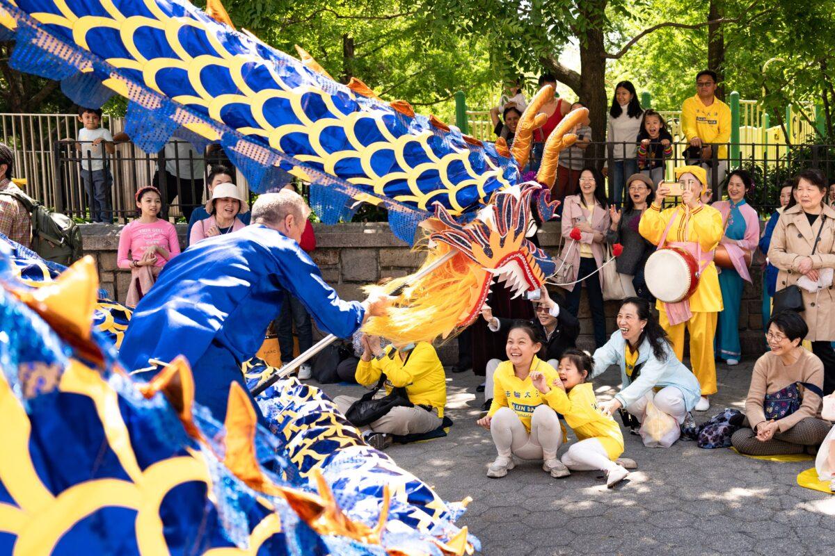 Falun Gong practitioners celebrate World Falun Dafa Day in New York City on May 7, 2023.(Samira Bouaou/The Epoch Times)