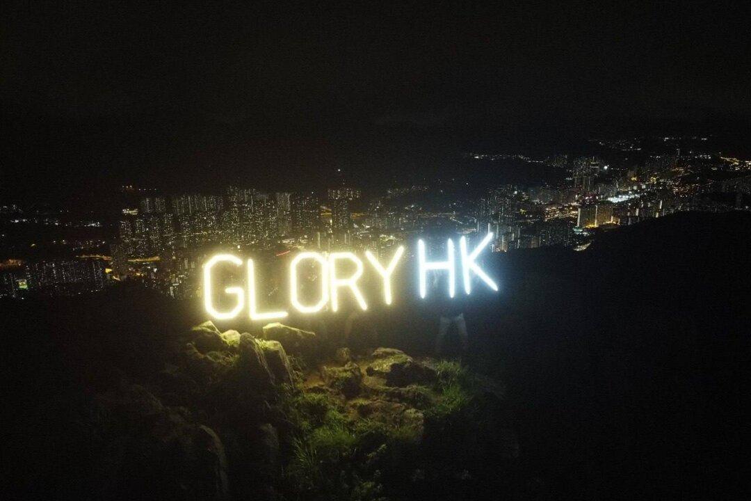 Hongkongers Held Aloft Their Appeal for Freedom and Light on Lion Rock Amidst Darkness