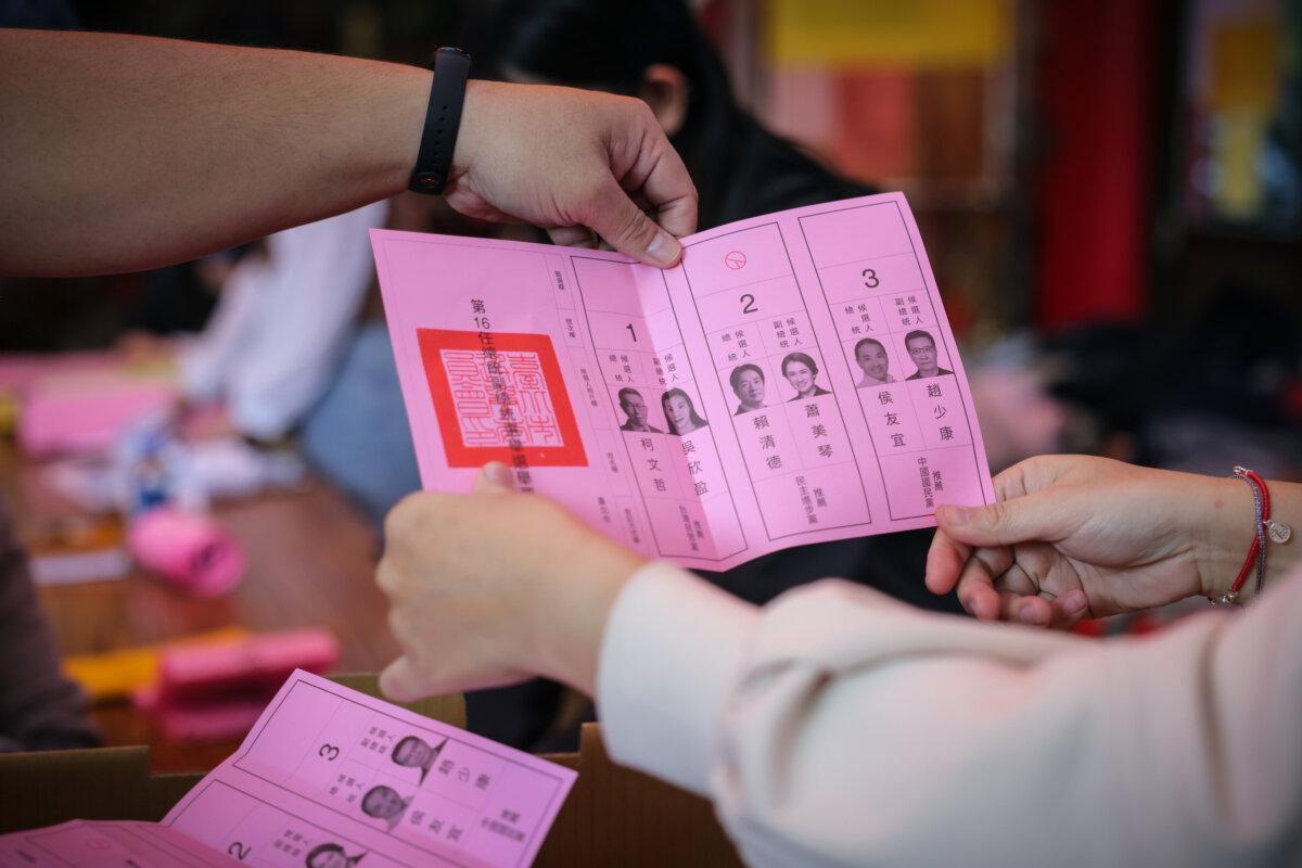 Election workers count voting ballots as the official counting gets underway in the presidential election on Jan. 13, 2024, in Taipei, Taiwan. (Annabelle Chih/Getty Images)