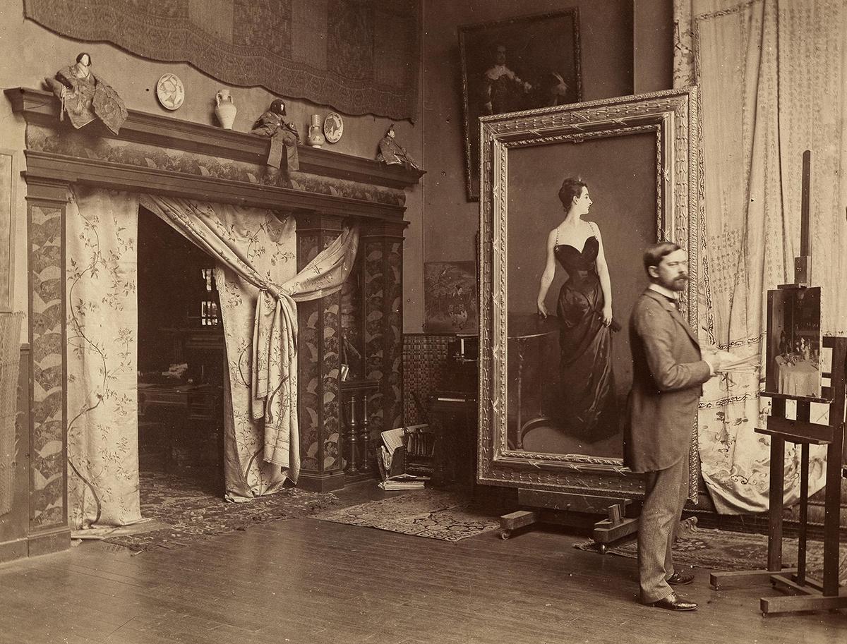 John Singer Sargent in his Paris studio with "Portrait of Madame X," circa 1885, photographed by Adolphe Giraudon. (Public Domain)