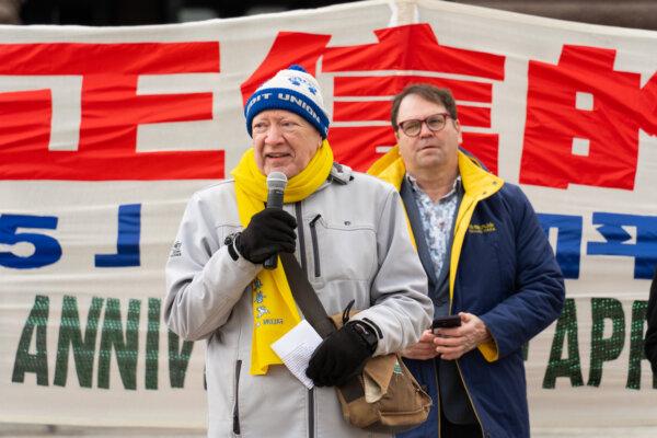 Michael Stainton (L), president of the Taiwanese Human Rights Association of Canada, addresses hundreds of Falun Gong adherents gathered at a rally on the grounds of the Ontario legislature to condemn the Chinese Communist Party's 25 years of repression of the spiritual practice, in Toronto on April 20, 2024. (Jerry Zhang/The Epoch Times)