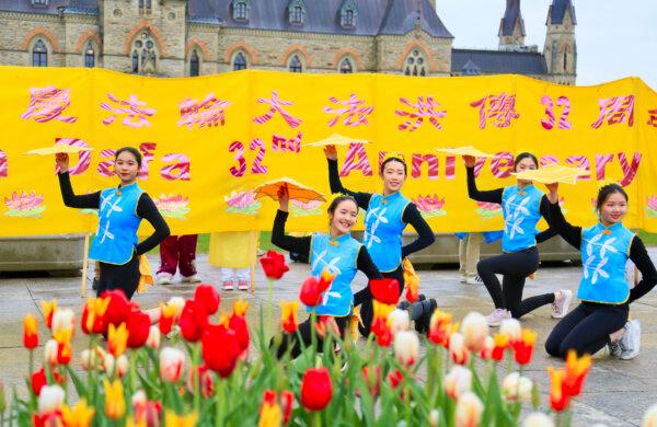 Falun Dafa practitioners perform a cultural dance during Falun Dafa Day celebrations on Parliament Hill in Ottawa on May 7, 2024. (Jonathan Ren/The Epoch Times)