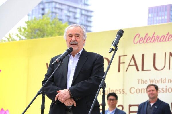 Former Senator Consiglio Di Nino speaks during a rally outside Toronto City Hall, where hundreds of Falun Gong adherents gathered to celebrate the 32nd World Falun Dafa Day on May 11, 2024. (Andrew Chen/The Epoch Times)