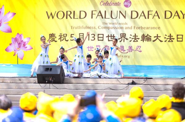 Young Falun Gong adherents perform traditional Chinese dances outside Toronto City Hall on May 11, 2024, to celebrate the 32nd World Falun Dafa Day. (Alex Gurevich/The Epoch Times)