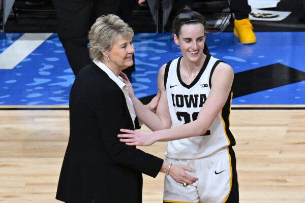 Iowa Coach Lisa Bluder and star guard Caitlin Clark talk after defeating LSU in an NCAA Tournament game in Albany, N.Y., on April 1, 2024. (Hans Pennink/AP Photo)