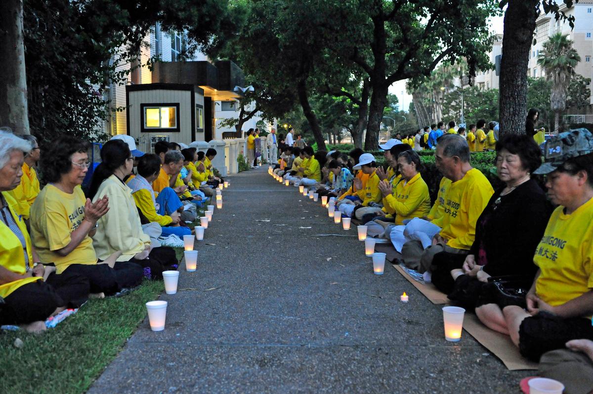 Candlelight Vigil Brings 14 Years of Persecution to Light