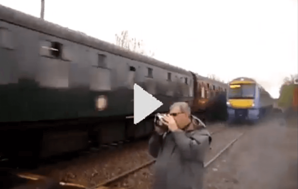 Train Spotter Inches From Being Killed by Train (Video)