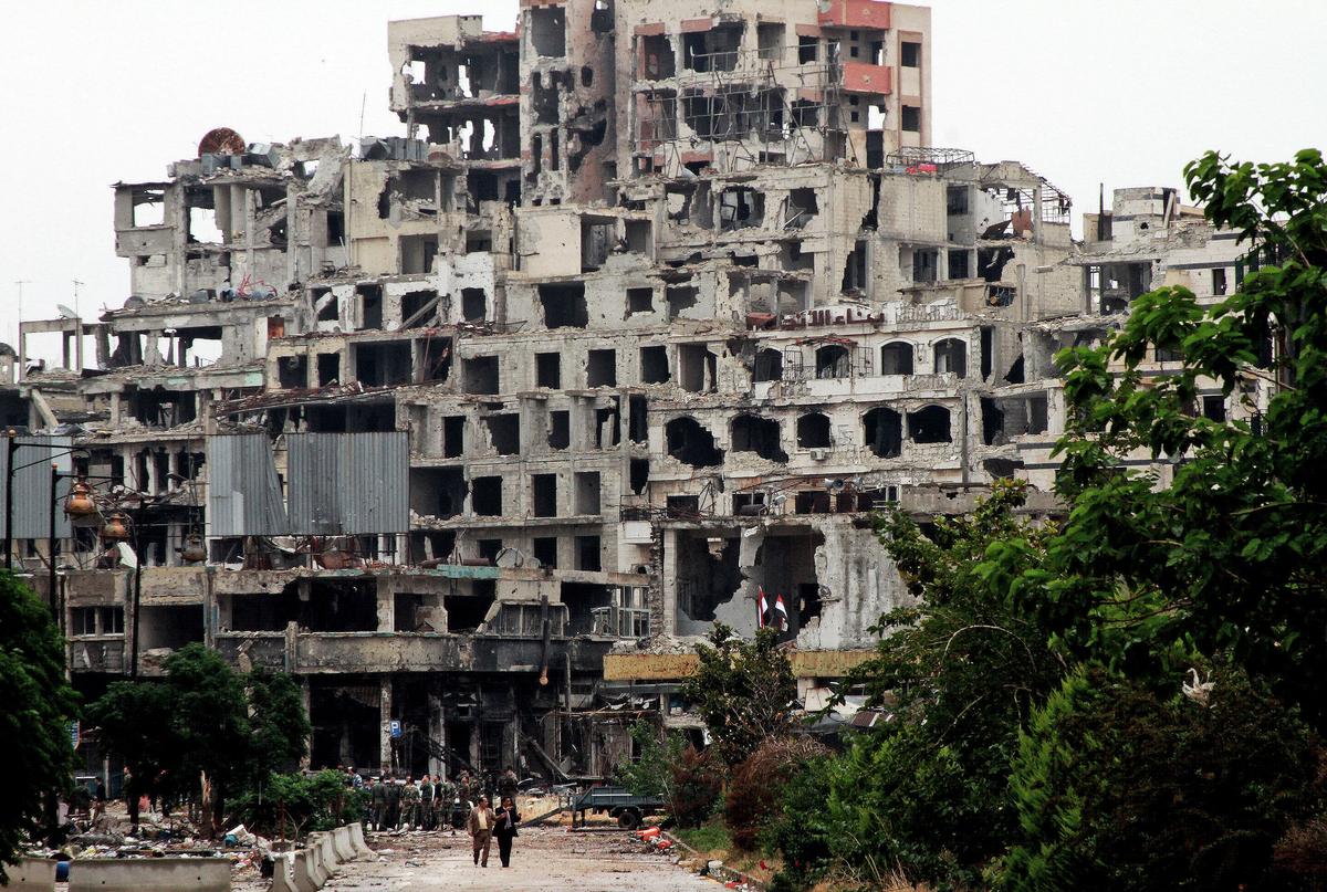 2 Bombs Hit Central Syria City of Homs, Wounding at Least 32