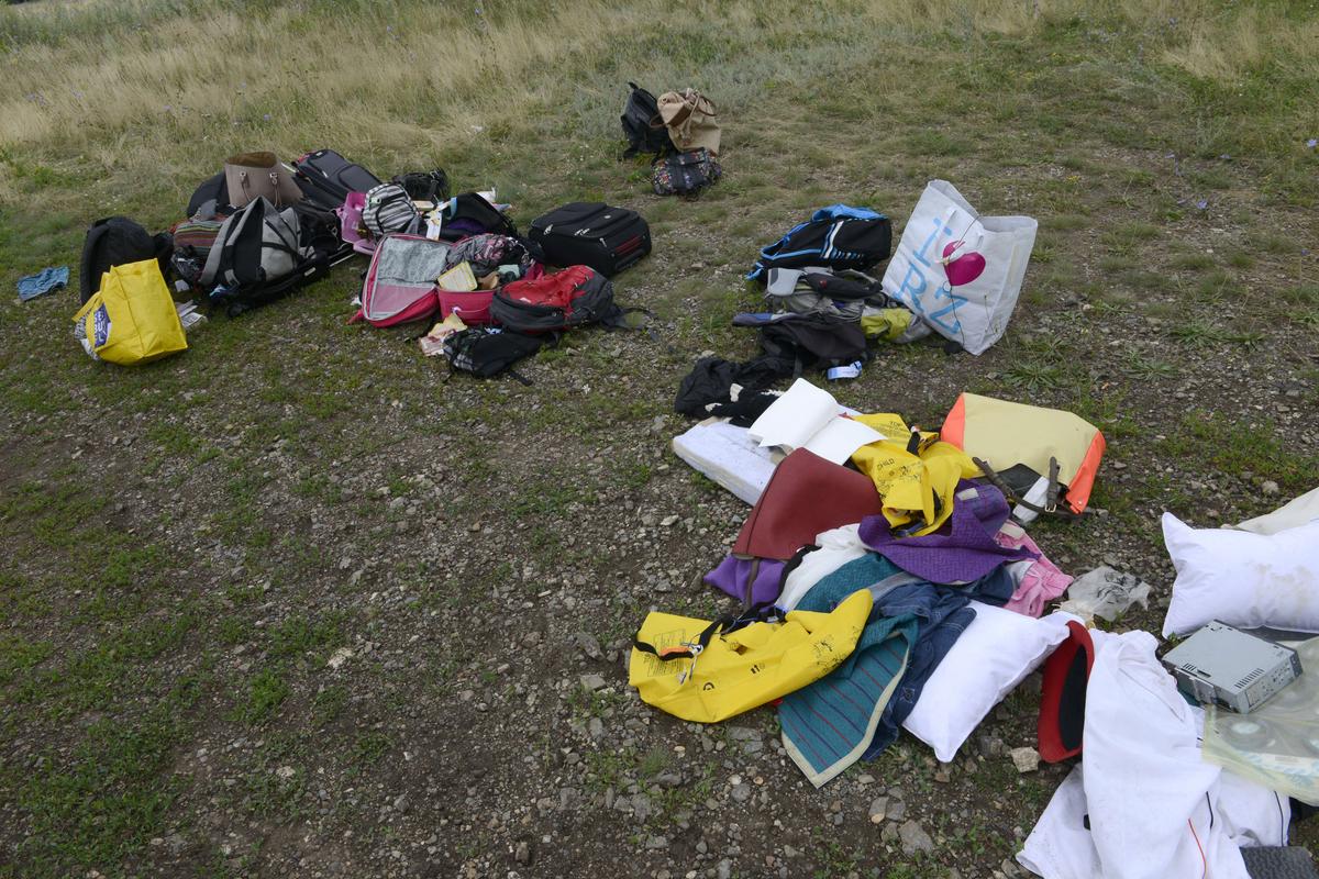 Malaysia Airlines Crash Photos: Pictures of MH17 Victims’ Belongings That Survived the Crash