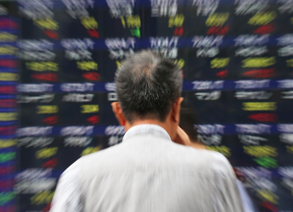 As Dow Average Drops Triple Digits, Investors Brace for Turbulence