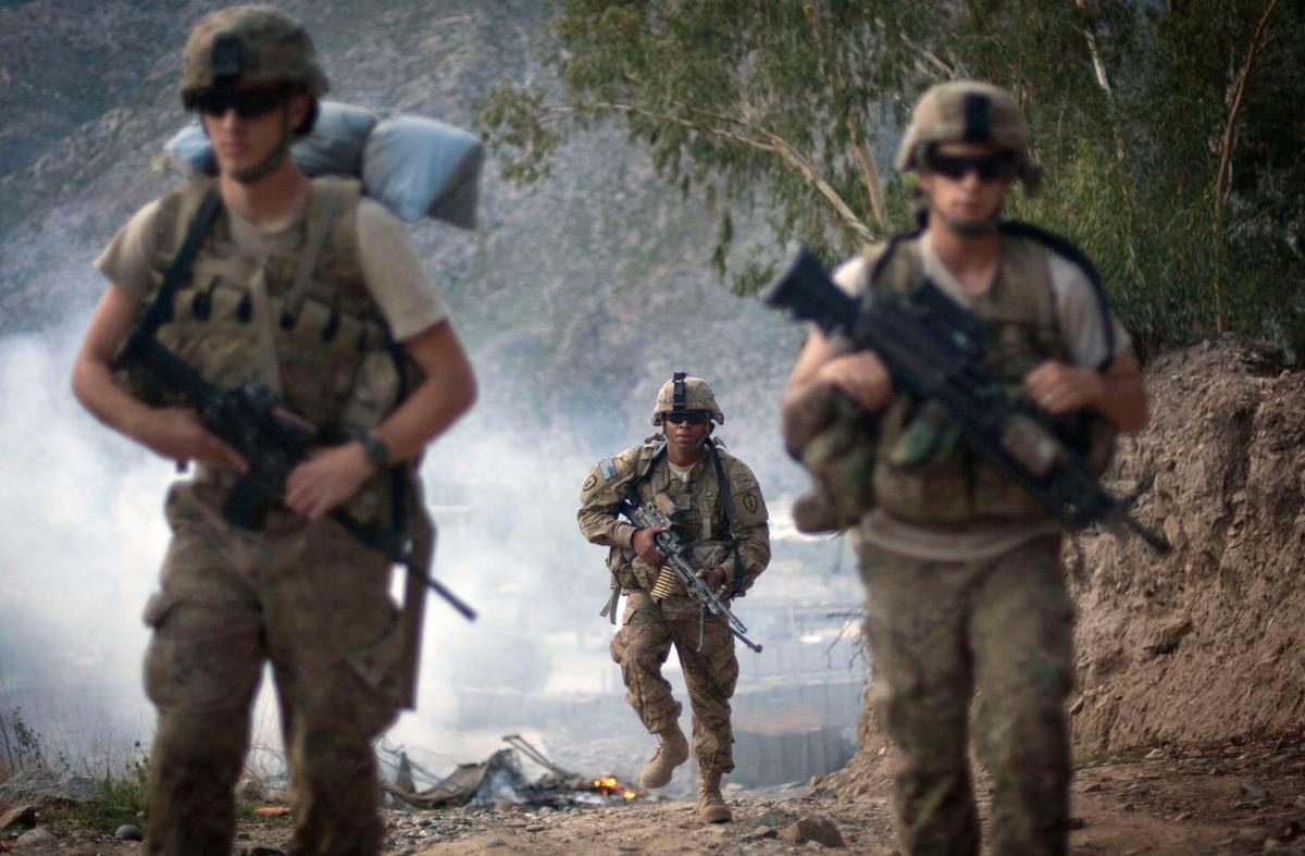 Obama Broadens Afghanistan Mission to Target Taliban