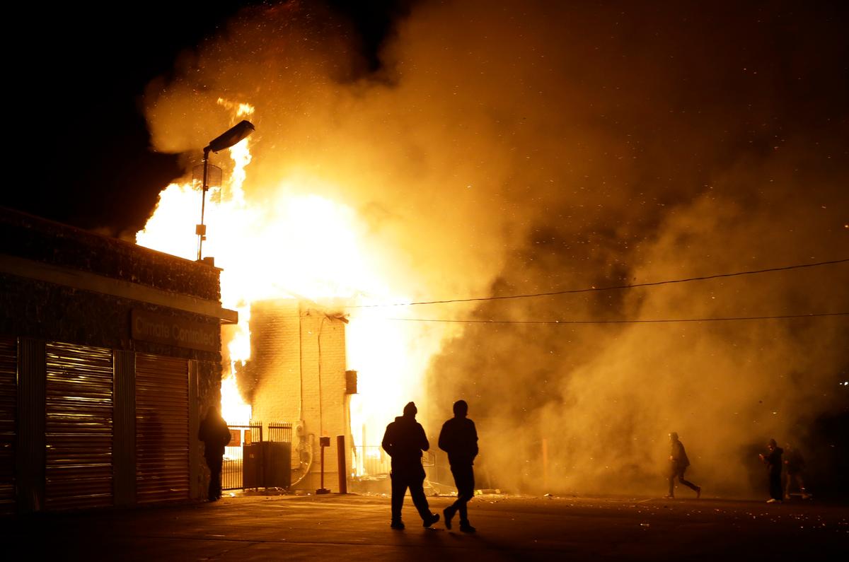 West Florissant Avenue in Ferguson, MO: Protestors Burn Buildings, Including The Original Red’s BBQ