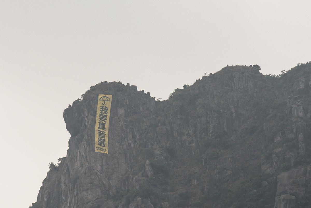 HK: Lion Rock ‘Genuine Universal Suffrage’ Banner Briefly Back