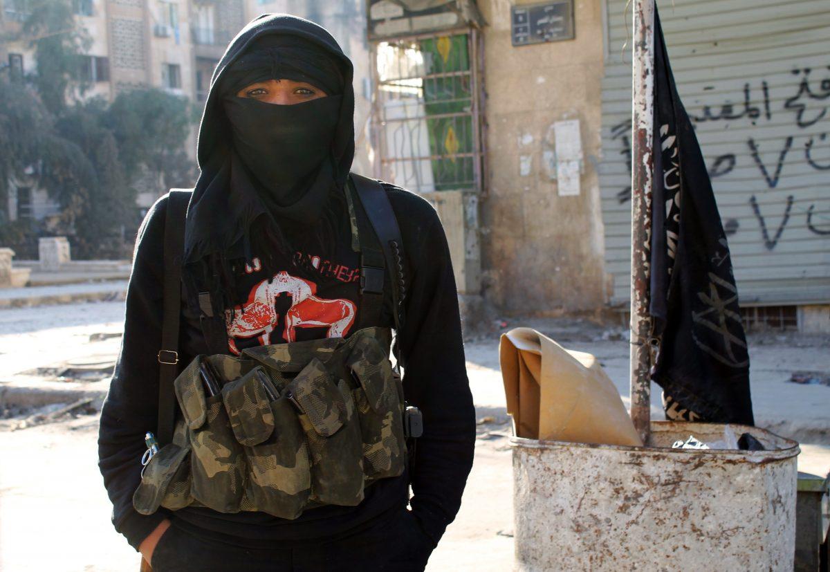 A member of al-Qaeda-linked terrorist group al-Nusra Front stands in a street of Aleppo, Syria, on Jan. 11, 2014. (Baraa Al-Halabi/AFP/Getty Images)