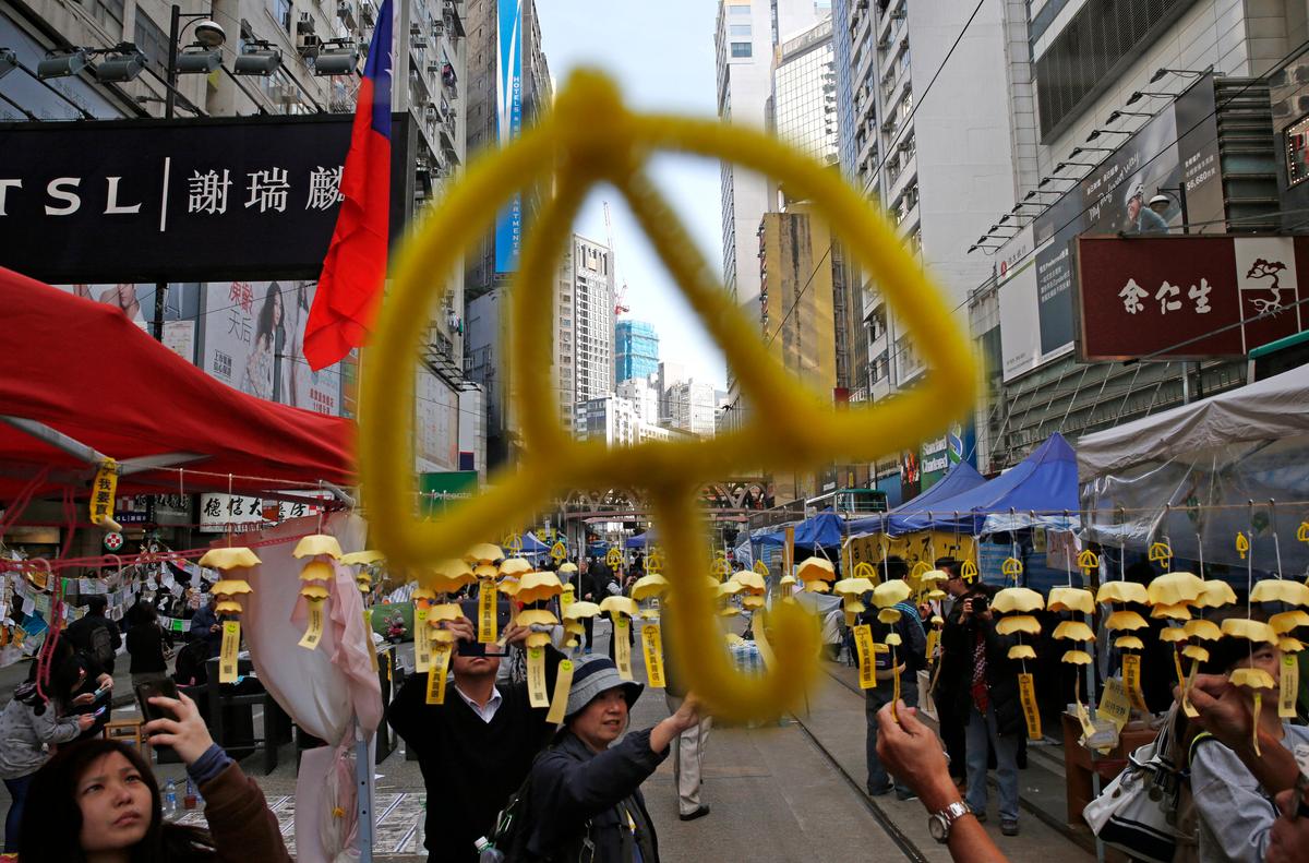 Before Final Protest Site Shut Down, Hong Kong Protesters Go Shopping, Caroling