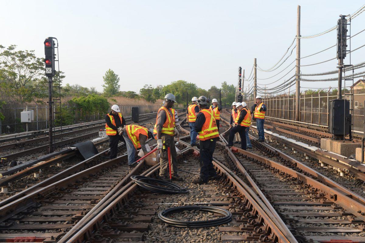 Workers repair a section of cable severed by vandals who stole 500 feet of copper cable from train tracks along the A subway line in New York City on May 27, 2015. (MTA/Marc A. Hermann via AP)