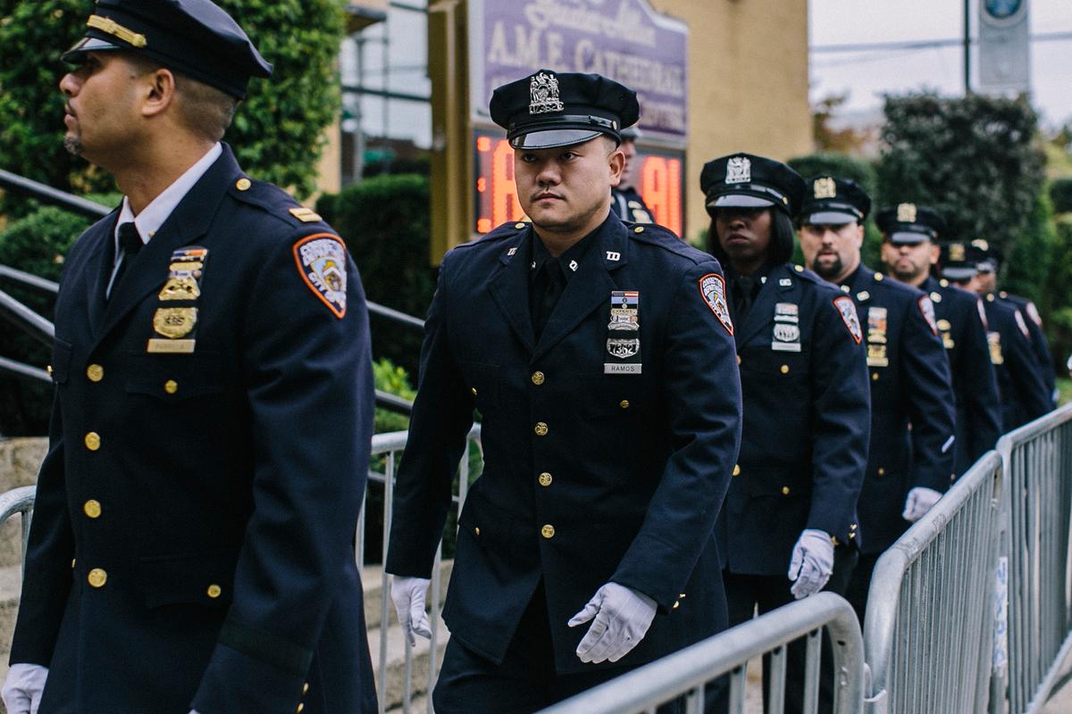 Officers Weep at Wake for Policeman Shot in Head on Duty