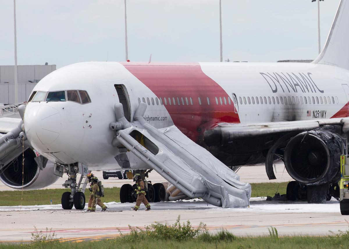 Plane Catches Fire at Airport; Passengers Evacuate on Slides