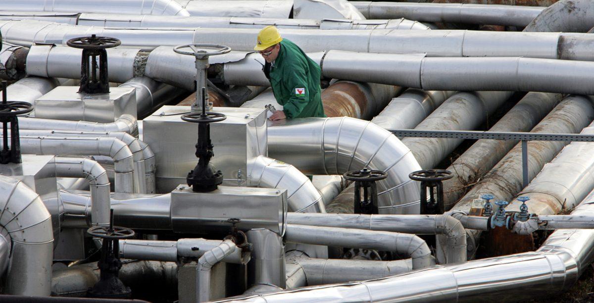 An engineer checks the refinery plant at the receiving station of the oil pipeline Druzhba in Szazhalombatta, south of Budapest, Hungary, on Jan. 9, 2007. (Attila Kisbenedek/AFP/Getty Images)