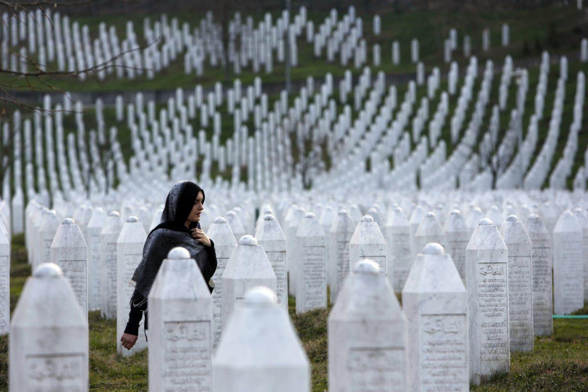 A Bosniak woman walks among gravestones at Memorial Centre Potocari near Srebrenica, Bosnia and Herzegovina, on March 20, 2016. (Amel Emric<strong>/</strong>AP Photo<strong>)</strong>