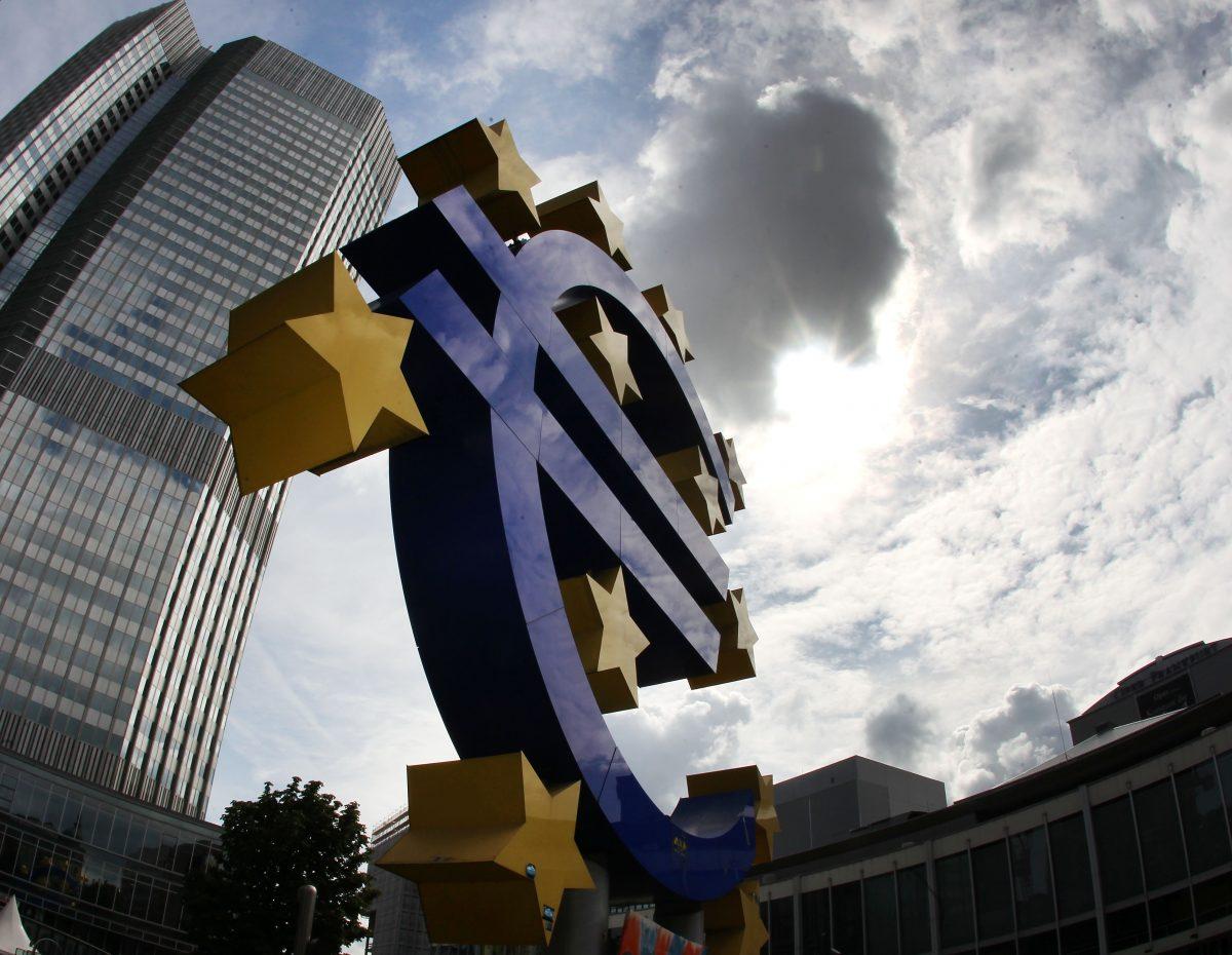 The euro sculpture in front of the headquarters of the European Central Bank in Frankfurt, Germany, on July 31, 2012. (Michael Probst /AP Photo)