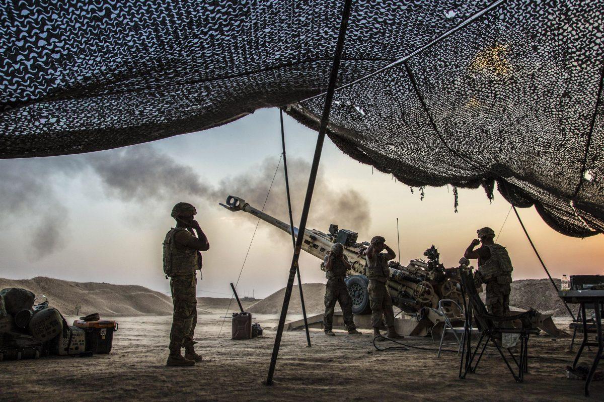 U.S. soldiers fire a howitzer to support Iraqi forces while supporting Operation Inherent Resolve, in northern Iraq in this undated photo. (Army photo by Cpl. Rachel Diehm)