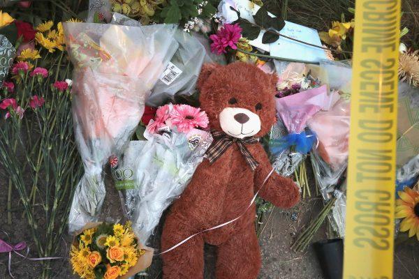 Crime scene tape falls across a small memorial near the First Baptist Church of Sutherland Springs in Sutherland Springs, Texas on Nov. 7, 2017. (Scott Olson/Getty Images)