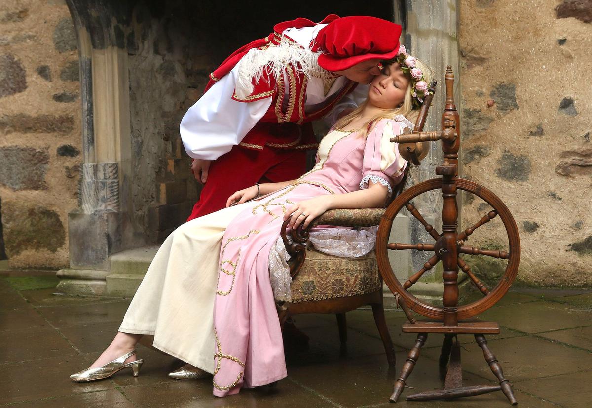 The prince kisses Sleeping Beauty to wake her from her 100-year sleep in a skit performed at Sababurg Palace in Hofgeismar, Germany. (Sean Gallup/Getty Images)