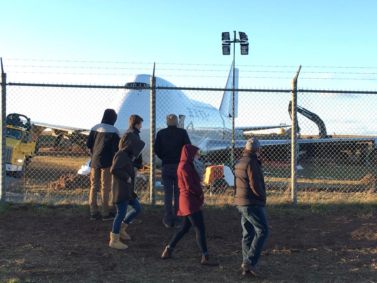 Crowd Watches as Backhoe Rips Into Mangled Plane After Halifax Runway Overrun