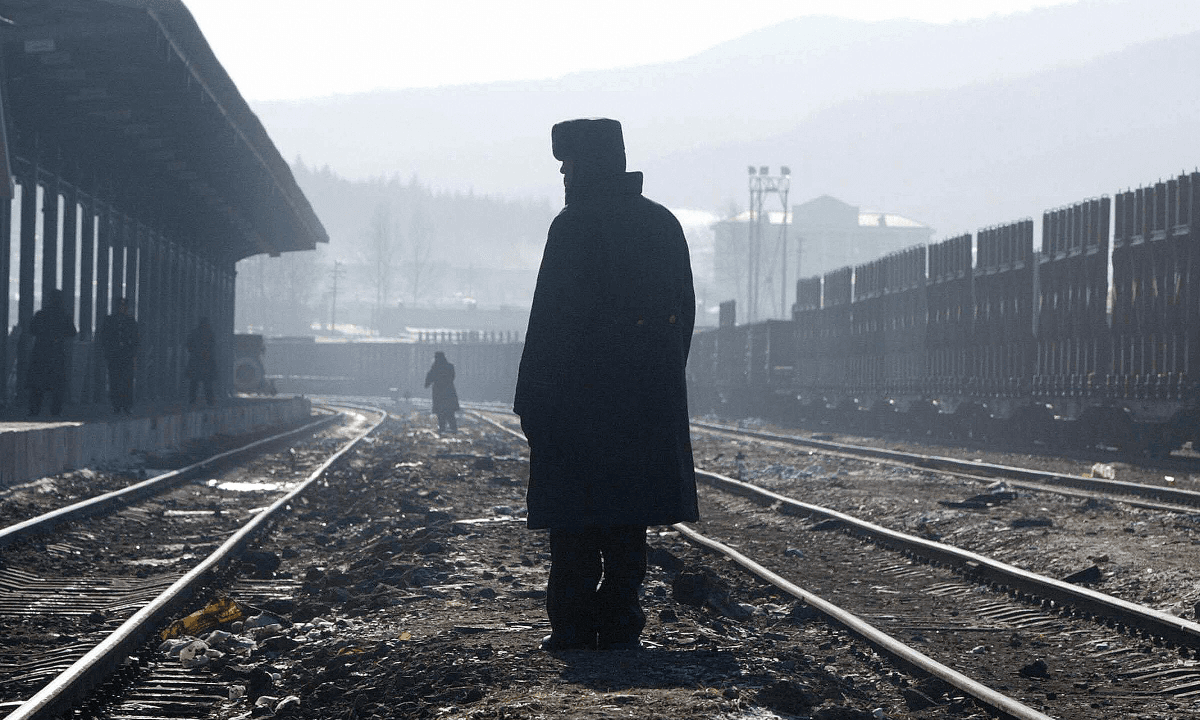 Man on Fire Lies on Railway Track, Authorities Take Photo and Walk Away