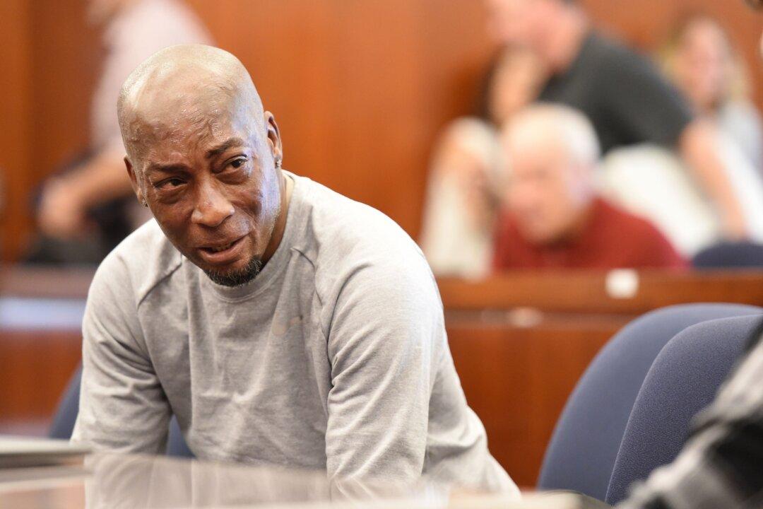 Plaintiff Dewayne Johnson reacts after hearing the verdict to his case against Monsanto at the Superior Court Of California in San Francisco, California, on August 10, 2018. - A California jury on Friday, August 10, 2018 ordered agrochemical giant Monsanto to pay nearly $290 million for failing to warn a dying groundskeeper that its weed killer Roundup might cause cancer. Jurors found Monsanto acted with "malice" and that its weed killers Roundup and the professional grade version RangerPro contributed "substantially" to Dewayne Johnson's terminal illness. (Photo by JOSH EDELSON / POOL / AFP)        (Photo credit should read JOSH EDELSON/AFP/Getty Images)