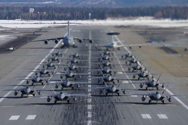 F-22 Raptors participate in an elephant walk with an E-3 Sentry and a C-17 Globemaster III at Joint Base Elmendorf-Richardson, Alaska, on March 26, 2019. (US Air Force)