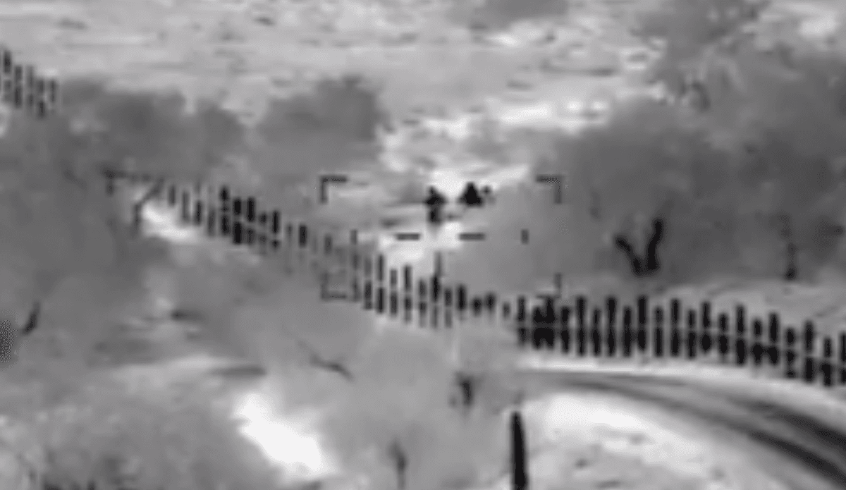 Video Shows Armed Men Escorting Mother and Son Across US Border